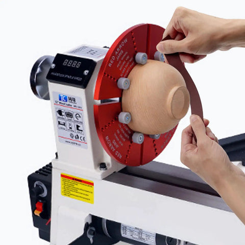Hands using Emery Cloth Roll Set Six Grits 80 150 240 320 400 600 Pro Grade Heavy Duty for woodworking on a wooden piece on lathe