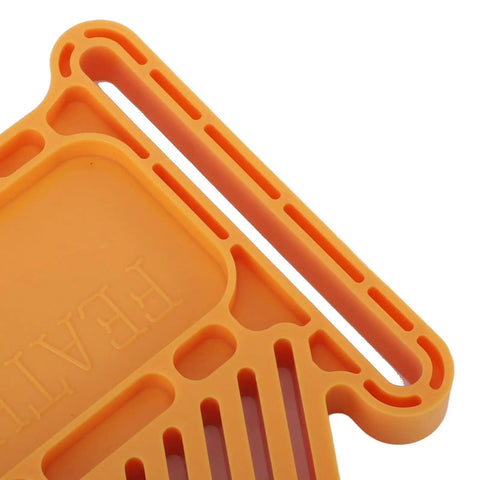 Close-up of Premium Wheat Featherboard For Router Tables And Band Saws in orange; durable plastic design with interlocking grooves.