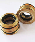 E50 hydraulic cartridge assembly, brass-colored with orange O-rings, two units