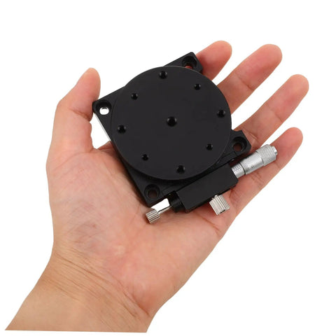 Insanely Steady Manual Precision Rotation Stage With Hella Smooth 60mm Aluminum Base and Ridiculously Precise Dial Control in hand.
