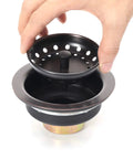 Hand holding strainer basket of Three And A Half Inch Kitchen Sink Drain Assembly With Strainer Basket And Stopper, Oil Rubbed Bronze, All Stainless Steel, Rustproof And Built To Last For Heavy Use