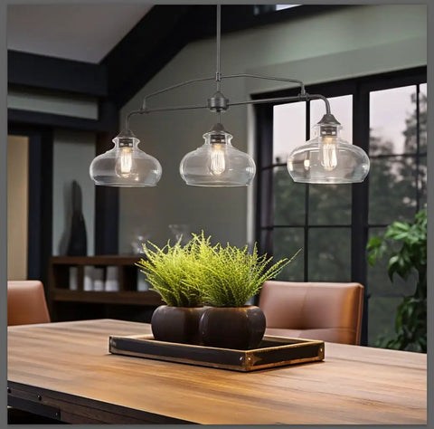 38 Inch 3 Light Modern Schoolhouse Island Light With Clear Glass Shades, Industrial Farmhouse Oil Rubbed Bronze Finish, shown over table