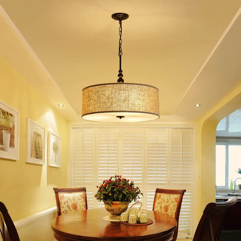 Beige Drum Pendant Chandelier For Dining Room, Farmhouse Style With White Linen Shade, hanging over table, cozy light