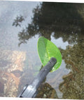 Extendable Garbage Grabber Stick With Smooth Clamp For Indoor Outdoor Cleanup Litter Picker Tool picking a leaf from water