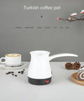 Stainless Steel Turkish Coffee Pot For Home Use 0.5L With 600W Heating Plate Removable Anti Scald Handle in white finish on table