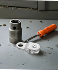 Swivel Rope Pulley Block With Bearing For 6mm Rope Cable Pulley Roller Guide For Lifting And Load Handling Portable Lightweight Cable Winch System For Indoor Outdoor Projects Quiet Smooth Operation Pro Grade Build, white metal pulley and socket on workbench