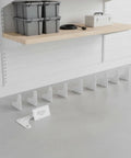 Transform Cluttered Garages Into Organized Spaces With A 6 Inch White Angle Steel Shelf Bracket For Heavy Duty Shelving Rock Solid L Shaped Support Featuring Pre Drilled Holes For Quick Install Into Wall Studs Or Uprights With Standard Hardware.