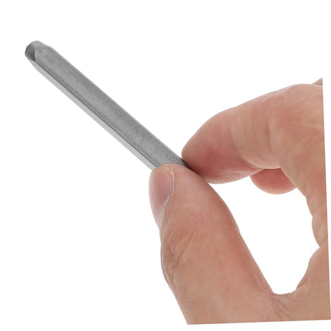 Close-up of a hand holding a punch tool from the 37 Piece Metal Stamping Kit With Letter And Number Punch Set Plus Heart Symbols