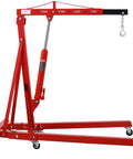 Heavy Duty Two Ton Folding Engine Hoist Cherry Picker Shop Crane with hydraulic ram and six swivel casters for easy maneuvering.