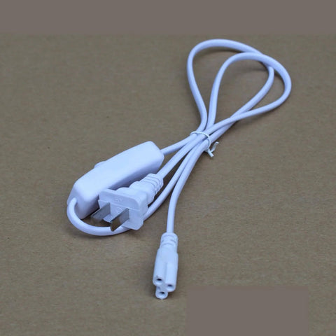 Two Pack T5 T8 Grow Light Power Cord With On Off Switch Five Foot US Plug Extension Cable coiled on brown surface