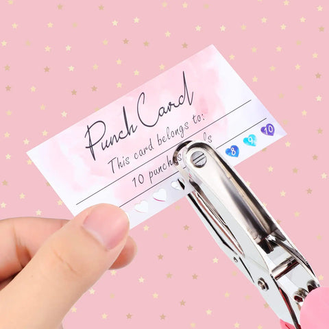 Top Shelf Blank Reward Cards With Zero Hassle Metal Heart Puncher With 100 Pack Hella Thick Coated Cardstock For DIY Crafting Small Biz Loyalty Rewards And Gift Tag Creations, hand holding punch card with heart puncher.