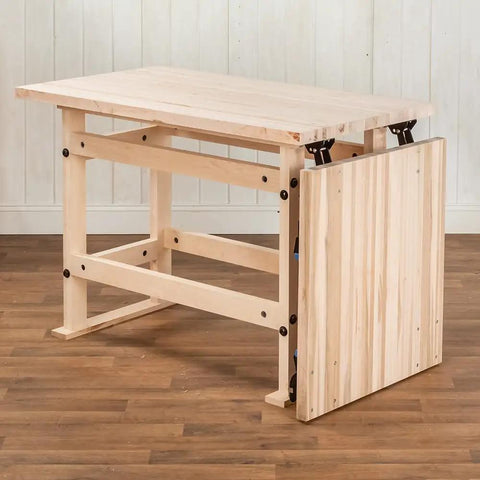Folding Top Extension Kit for workbench shows space-saving expansion with stable foldout design, adds large work surface.