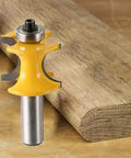 Close-up of a router bit from the Five Pack One Half Inch Shank Bullnose Router Bit Set With Carbide Tipped Half Round Edge Bits For Bead And Radius Work Radius One Eighth Three Sixteenths One Quarter Five Sixteenths Three Eighths Inches Bead Sizes One Quarter To Three Quarters, shown against wood for demonstrating radius cutting.
