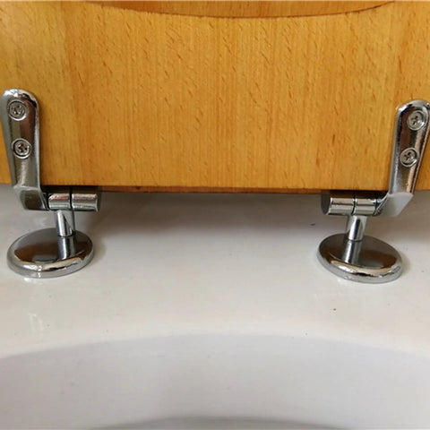 Premium Solid Wood Beech Elongated Toilet Seat With Rock Solid Stainless Steel Hinges showing durable metal hinge installation.