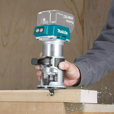 Person using Pro Grade Compact Cordless Router With Brushless Motor, 18V LXT, Variable Speed For Smooth Precise Cuts XTR01Z on wood