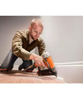 Man using Two And One-Eighth Inch 18-Gauge Brad Nailer with Clean Drive Technology for smooth fastening in woodworking project