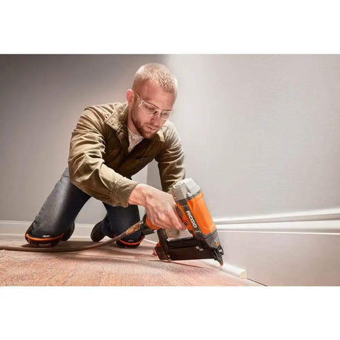 Man using Two And One-Eighth Inch 18-Gauge Brad Nailer with Clean Drive Technology for smooth fastening in woodworking project
