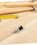 Stainless Steel Spring Indexing Plunger With Fast Reset Mechanism Snaps Back Into Position Dead Nuts Every Time For Heavy Machinery And Garage Builds Solid Tool Parts That Never Drop The Ball on wooden workbench with measuring tools.