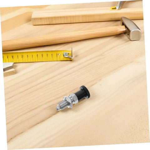 Stainless Steel Spring Indexing Plunger With Fast Reset Mechanism Snaps Back Into Position Dead Nuts Every Time For Heavy Machinery And Garage Builds Solid Tool Parts That Never Drop The Ball on wooden workbench with measuring tools.