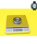 6905 Hybrid Ceramic Bearing 25X42X9MM ABEC-1 Si3N4 Steel Rings on a scale showing weight of 37.98 grams.