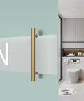 Titanium Gold Round Barn Door Handles Set, Double Sided Pull Push For French Doors And Exterior Shower Doors, shown in a modern bathroom.