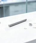 Real Deal Heavy Duty 5 Pack 5Mm X 100Mm Stainless Steel Precision Shaft Rod on a workbench with other RC car parts.