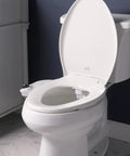 SlimEdge Non Electric Bidet Attachment For Toilet With Dual Front And Rear Nozzles installed on a white toilet