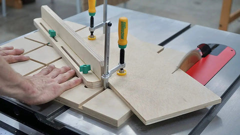 Woodworker using Matchfit Dovetail Clamp Bundle 4 Pack Exclusive DVC-538MB-50 with One Half Inch Dovetail Router Bit on table saw