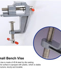 Rock Solid Mini Bench Vise, Clamp On Table Workstation Setup, heavy duty small bench vise with 45 steel jaws and red grips.