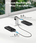 Heavy Duty 10000mAh Power Bank Featuring Reinforced Built In Four Cables For Multi Device Fast Charging And All Day Road Trip Juice To Keep Every Screen Alive connected to wall adapter with USB A and USB C inputs.