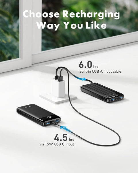 Heavy Duty 10000mAh Power Bank Featuring Reinforced Built In Four Cables For Multi Device Fast Charging And All Day Road Trip Juice To Keep Every Screen Alive connected to wall adapter with USB A and USB C inputs.