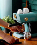 Electric Coffee Maker With Auto Milk Frother For Smooth Cappuccino Sips on wooden counter with espresso shot and frothing pitcher.