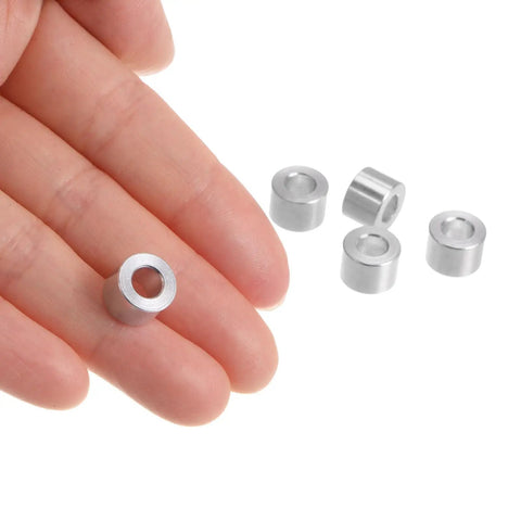 Person holding Aluminum Spacer Set 5mm Bore 10mm OD 8mm Length Standoff Bushing For M5 Screws Bolts And Rods Plain Finish Round Spacers