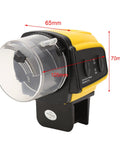 Dead Simple Automatic Fish Feeder With Battery Powered Digital Timer and Sleek LCD Panel, yellow plastic design, 105mm size.