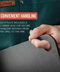 Hand holding High Heat Pizza Steel For Oven And Grill 13 By 13 Inch One Quarter Inch Thick with lifting hole