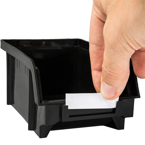Close-up of a hand placing a label on a 30 Compartment Wall Mounted Tool Organizer Bins Set For Tools, black plastic bin.