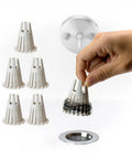 Five Pack Reusable Bathtub Hair Catcher Drain Strainer And Sink Trap Made From Eco Friendly Bioplastic, hand holding strainer with hair.