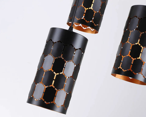 Close-up of 3 Light Modern Kitchen Island Pendant Lights with Cylindrical Metal Cage, black exterior and gold inner finish