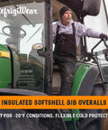 Extreme Cold Insulated Bib Overalls For Men And Women, Tough As Nails Waterproof Wind Resistant Snow Coveralls With 400 Plus Grams Of Warmth, Heavy Duty Winter Work Gear, Black And Lime, XXL, person in green tractor cab wearing bib overalls