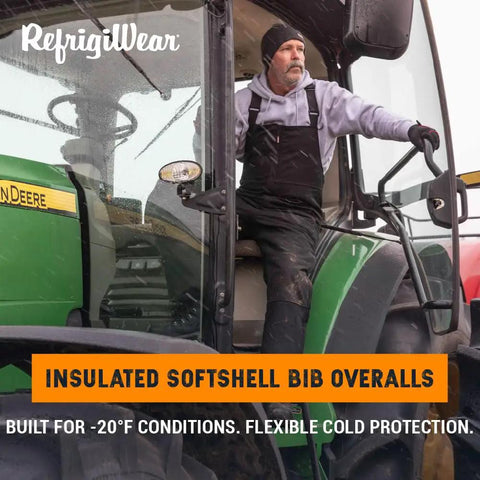 Extreme Cold Insulated Bib Overalls For Men And Women, Tough As Nails Waterproof Wind Resistant Snow Coveralls With 400 Plus Grams Of Warmth, Heavy Duty Winter Work Gear, Black And Lime, XXL, person in green tractor cab wearing bib overalls