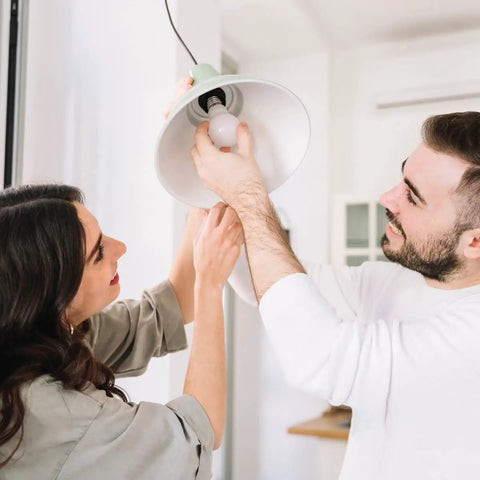 Couple installing A15 LED Filament Bulbs, 7W Equal 60W, Dimmable 2700K Warm White, E26 Base, 850 LM, into ceiling fixture