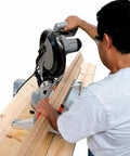 Person using Heavy Duty Crown Molding Jig For Miter Saw Featuring Adjustable Fence Built To Throw Dead On Cuts on wood.