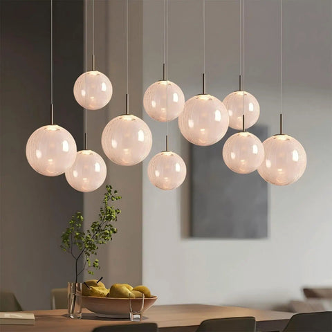 Top Shelf Modern Crackle Glass Sphere Pendant Cluster Integrated Led Brass Finish Adjustable Cord Lighting For Duplex Staircases Heavy Duty Mounting Is Big Time Game Changer over dining table with decorative plants.