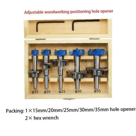 Front view of a 5-piece Forstner drill bit set with blue knobs in a wooden storage box; sizes 15–35 mm.