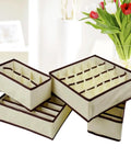 Premium Fashion Forward Non Woven Foldable Drawer Organizer Set For Bras Underwear Socks And Ties, stacked beige dividers with brown trim.