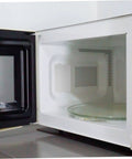Microwave interior with installed 10 Piece Microwave Mica Sheets Set For Replacement Mica Plates Heat Resistant Insulation.