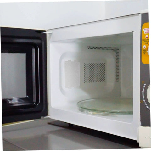 Microwave interior with installed 10 Piece Microwave Mica Sheets Set For Replacement Mica Plates Heat Resistant Insulation.