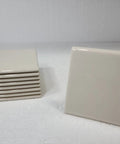 Beige Bone Almond Ceramic Bullnose Tile 4x4 Square Trim With Curved Edge 9 Piece Box Classic Color 006 displayed at angle