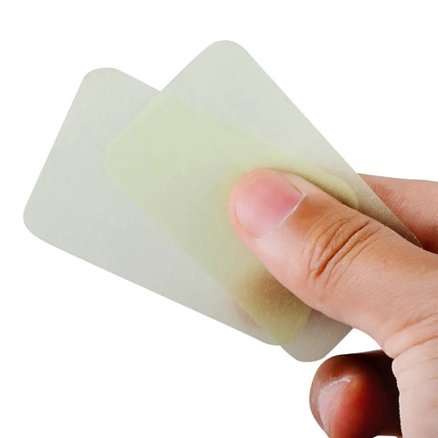 Close-up of fingers holding On The Go Hand Soap Sheets For Travel And Outdoors, 100 Sheets Biodegradable Plant Based Wash