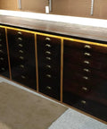 Workshop cabinets with bronze shell-shaped knobs; ideal for adding vintage style with Antique Bronze Iron Drawer Knob Set 10 Pack Vintage Cabinet Pulls.